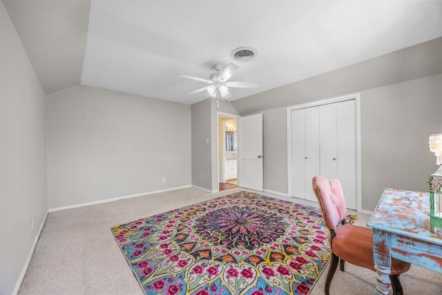 home office featuring carpet, vaulted ceiling, ceiling fan, and baseboards