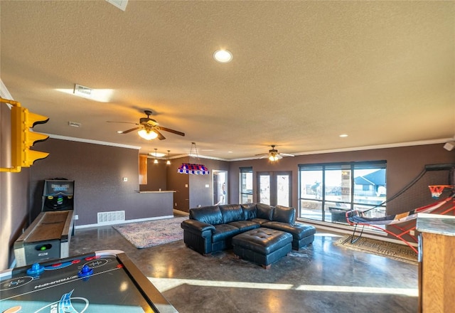 living room featuring baseboards, visible vents, finished concrete flooring, and a textured ceiling