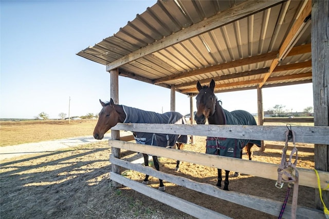 view of stable featuring a rural view