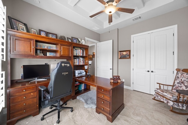 office space featuring ceiling fan, visible vents, and a tray ceiling