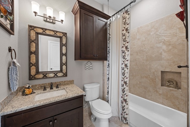 full bathroom featuring shower / bath combo, vanity, and toilet