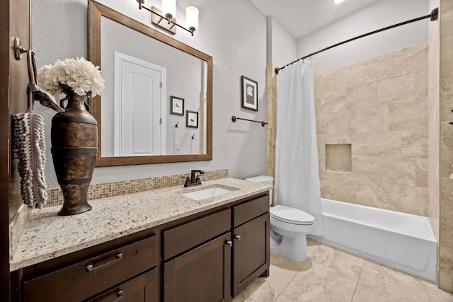 bathroom with shower / tub combo with curtain, vanity, and toilet