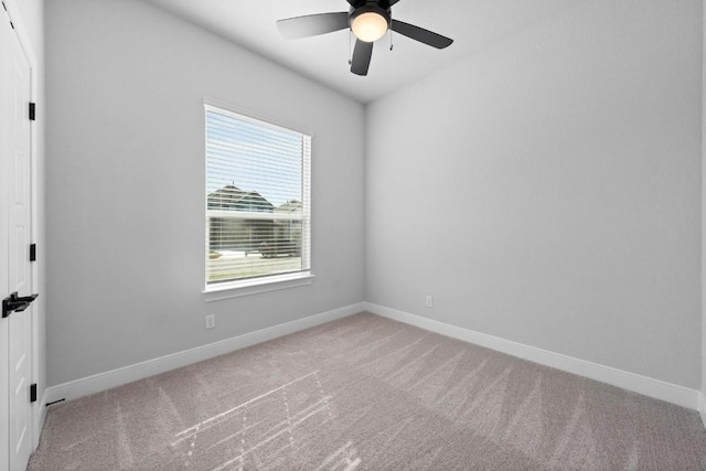 unfurnished room featuring ceiling fan, carpet floors, and baseboards