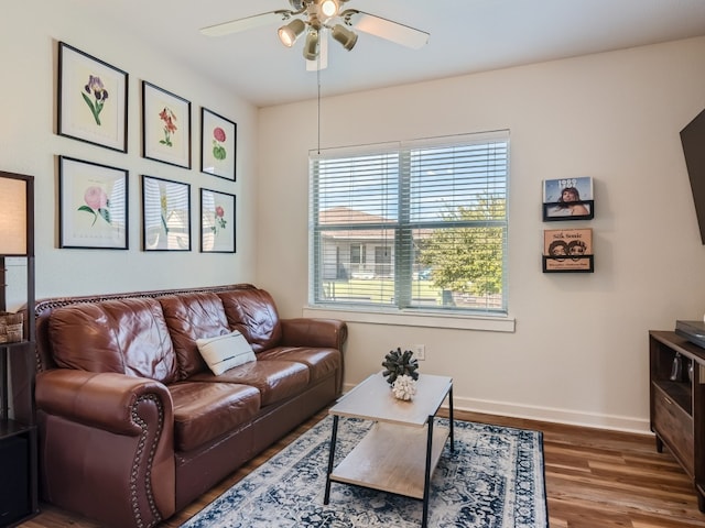 1201 Grove Blvd Unit 2803, Austin, TX 78741 - living room with a ceiling fan, wood finished floors, and baseboards