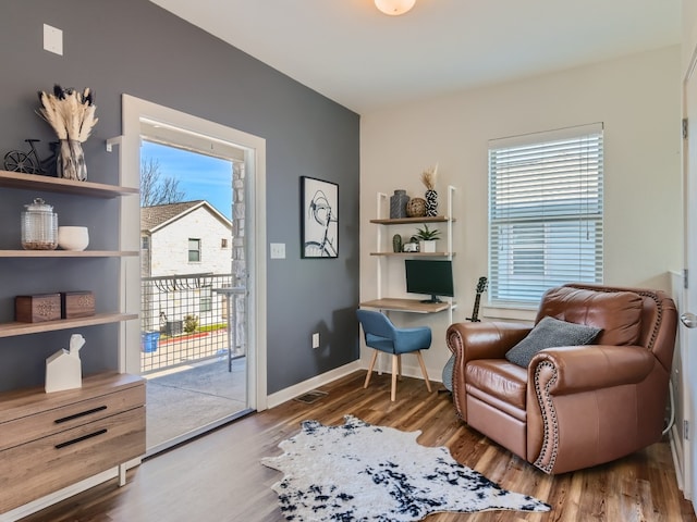 1201 Grove Blvd Unit 2803, Austin, TX 78741 - sitting room featuring wood finished floors and baseboards