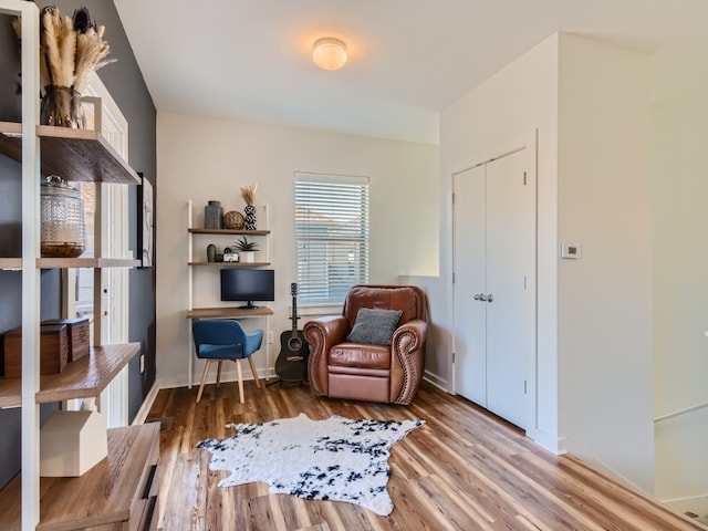1201 Grove Blvd Unit 2803, Austin, TX 78741 - sitting room featuring wood finished floors and baseboards