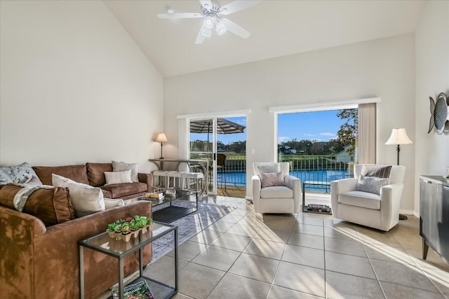 living room featuring light tile patterned floors, high vaulted ceiling, and ceiling fan