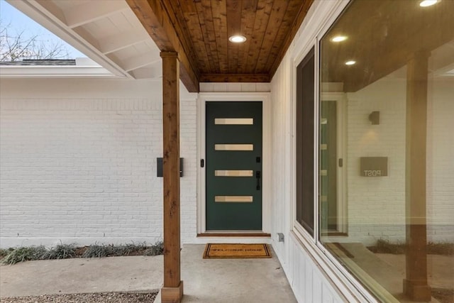 property entrance with brick siding