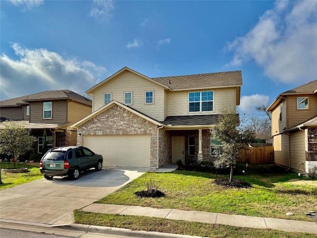 traditional home featuring a garage, concrete driveway, brick siding, and a front yard