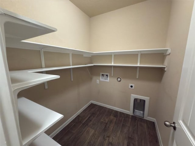 clothes washing area with laundry area, hookup for a gas dryer, dark wood-style flooring, hookup for a washing machine, and electric dryer hookup