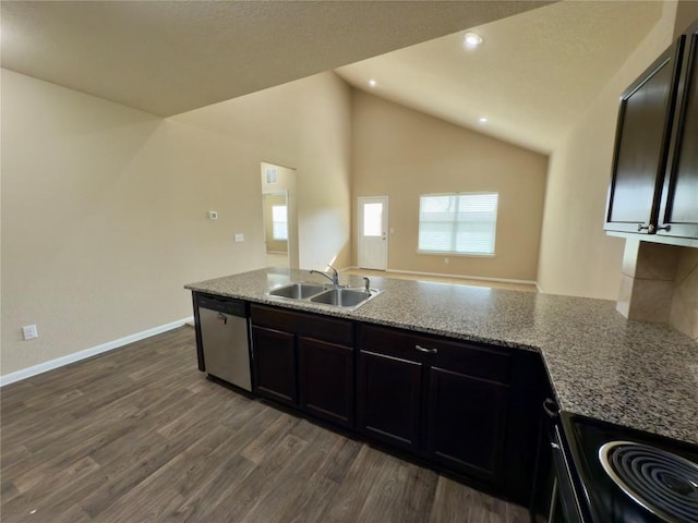 kitchen with dark wood finished floors, dishwasher, light stone counters, a sink, and range with electric stovetop