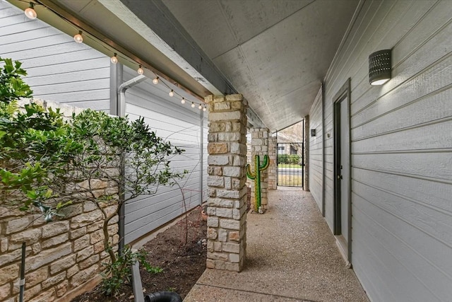 view of patio with a gate