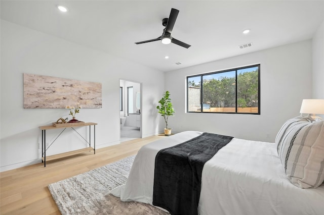 bedroom with baseboards, recessed lighting, visible vents, and light wood-style floors