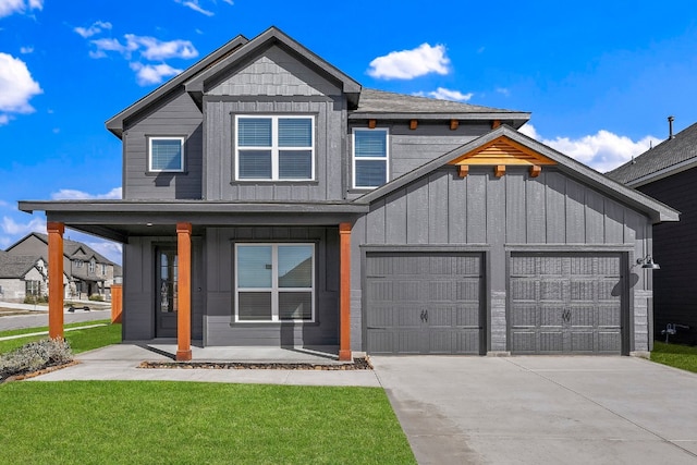 view of front facade with a garage, a porch, and board and batten siding