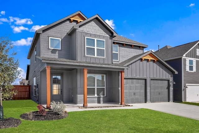 view of front facade featuring covered porch, concrete driveway, board and batten siding, a front yard, and fence