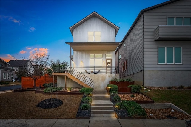 view of front of home featuring a porch and stairs