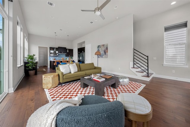 6221 Seville Dr, Austin, TX 78724 - living area with visible vents, recessed lighting, wood-type flooring, baseboards, and stairs