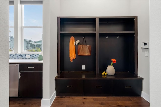 6221 Seville Dr, Austin, TX 78724 - mudroom featuring dark wood-style floors and baseboards