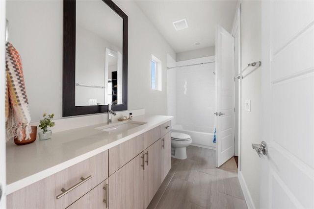 6221 Seville Dr, Austin, TX 78724 - full bathroom featuring visible vents, toilet, vanity, and shower / bathtub combination