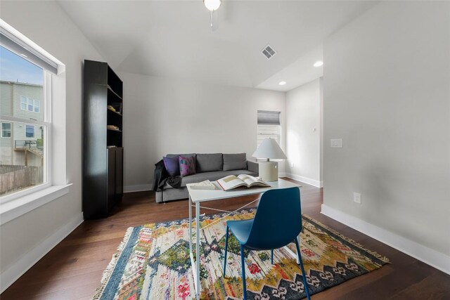 6221 Seville Dr, Austin, TX 78724 - living room featuring recessed lighting, wood finished floors, visible vents, and baseboards
