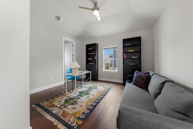 6221 Seville Dr, Austin, TX 78724 - living area featuring visible vents, baseboards, vaulted ceiling, a ceiling fan, and wood-type flooring