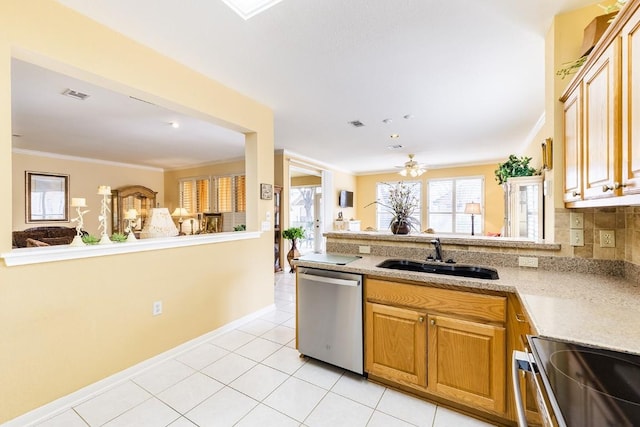 kitchen featuring visible vents, ornamental molding, stainless steel appliances, a sink, and light tile patterned flooring