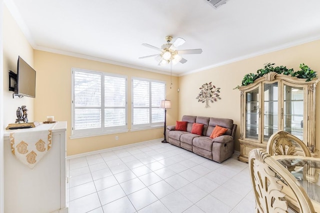 living room with light tile patterned floors, baseboards, visible vents, a ceiling fan, and ornamental molding