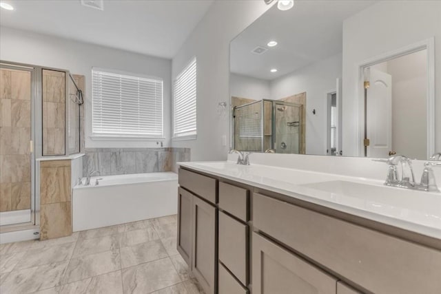 full bathroom featuring a garden tub, a sink, a shower stall, and double vanity