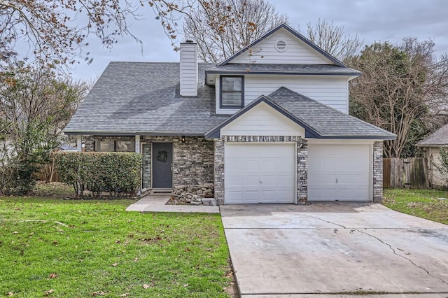 traditional home with a garage, a front lawn, concrete driveway, and roof with shingles