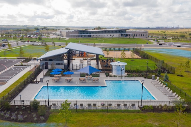 pool with a yard, fence, a patio, and a gazebo