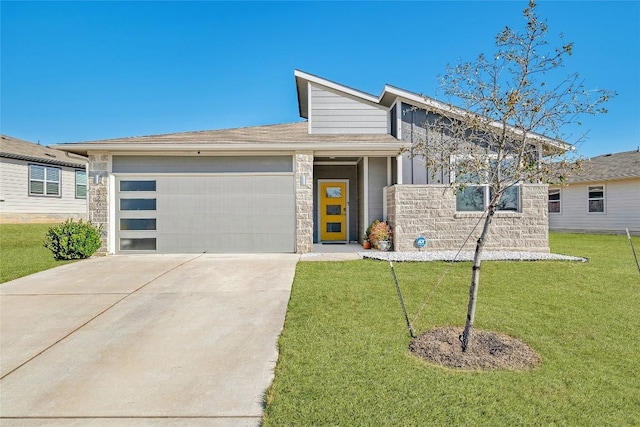 view of front of home featuring a garage, stone siding, concrete driveway, and a front yard