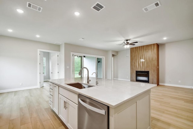 kitchen with visible vents, a sink, and dishwasher