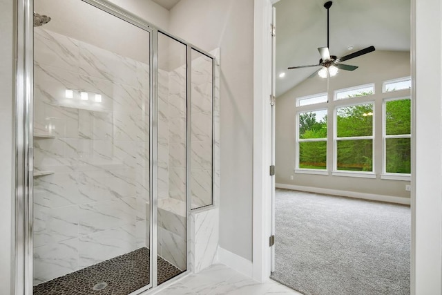 bathroom with baseboards, a marble finish shower, ceiling fan, and vaulted ceiling