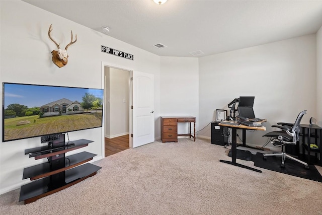 home office with carpet, visible vents, and baseboards