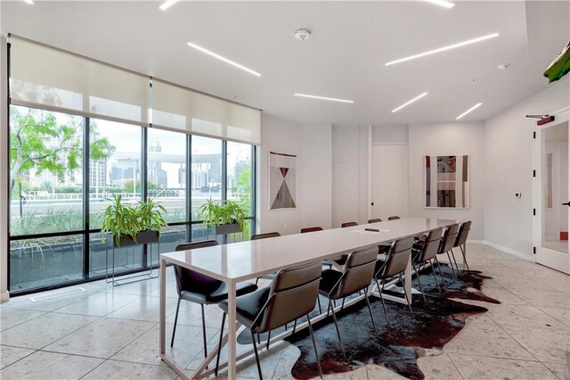 800 Embassy Dr Unit 319, Austin, TX 78702 - dining room with plenty of natural light, light tile patterned flooring, and baseboards