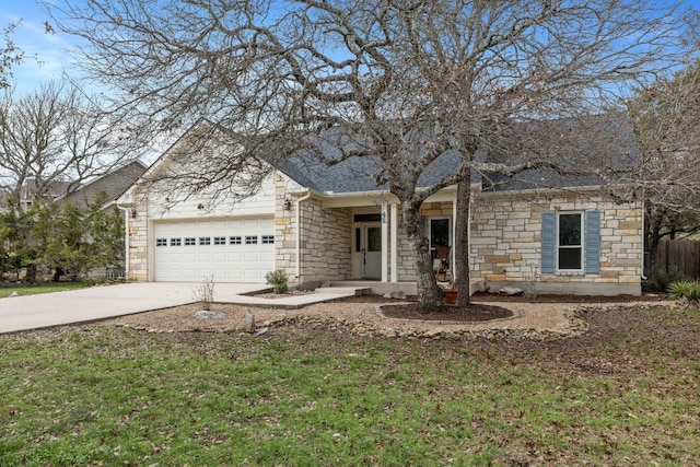 view of front facade featuring driveway, stone siding, a shingled roof, and a garage