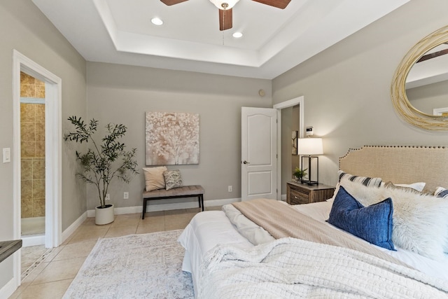 bedroom with light tile patterned floors, baseboards, a ceiling fan, a tray ceiling, and recessed lighting