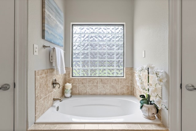 bathroom with a garden tub