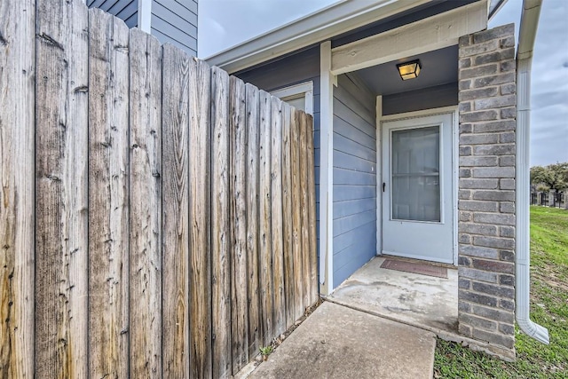 doorway to property with fence