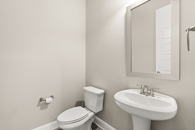 3809 Alpine Ridge Cv, Leander, TX 78641 - half bathroom with a sink and baseboards