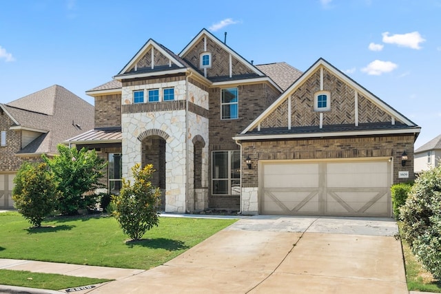 3809 Alpine Ridge Cv, Leander, TX 78641 - view of front of home with stone siding, a front lawn, concrete driveway, an attached garage, and a standing seam roof