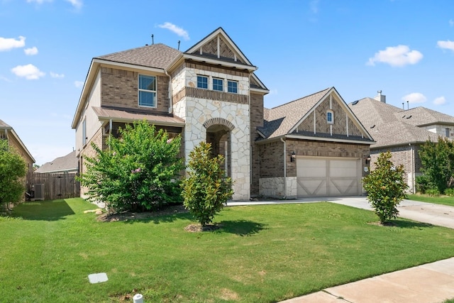 3809 Alpine Ridge Cv, Leander, TX 78641 - view of front of property featuring stone siding, a garage, concrete driveway, and roof with shingles
