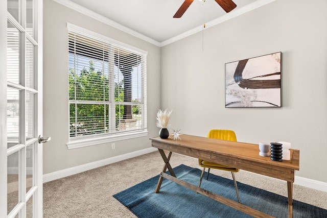 carpeted office space featuring ornamental molding, baseboards, and a ceiling fan