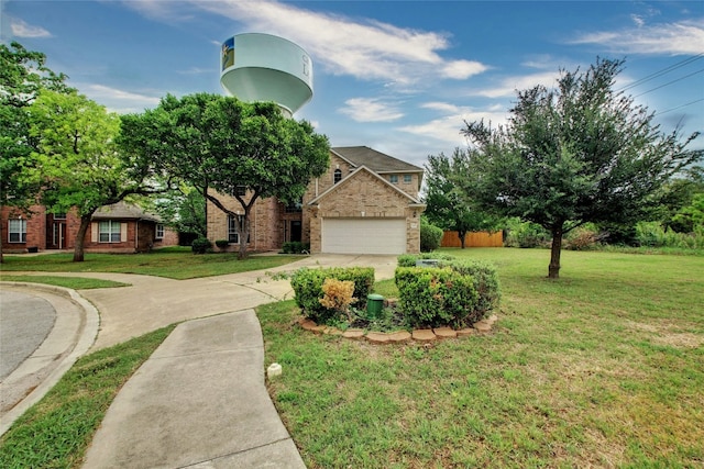 view of front of house featuring concrete driveway, an attached garage, fence, a front lawn, and brick siding