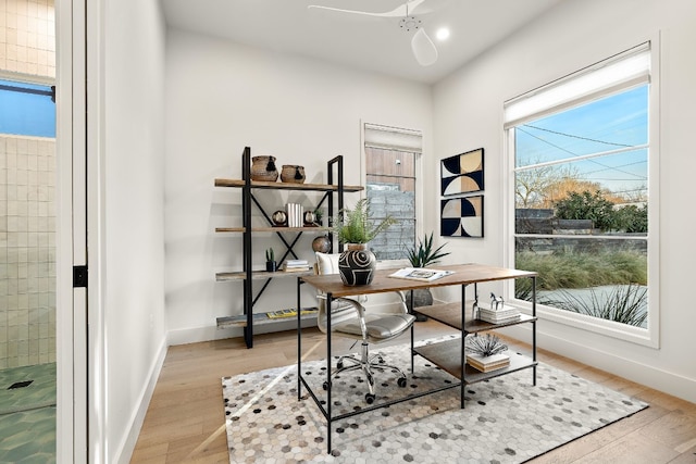 home office featuring light wood-style flooring and baseboards