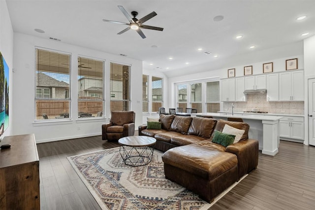 living room with recessed lighting, wood finished floors, visible vents, and ceiling fan
