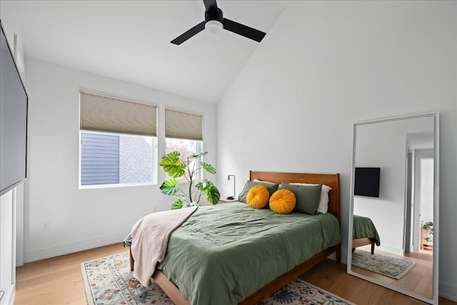 3204 Garden Villa Ln Unit 2, Austin, TX 78704 - bedroom with high vaulted ceiling, wood finished floors, a ceiling fan, and baseboards