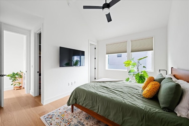 3204 Garden Villa Ln Unit 2, Austin, TX 78704 - bedroom featuring light wood-style flooring, baseboards, lofted ceiling, and a ceiling fan