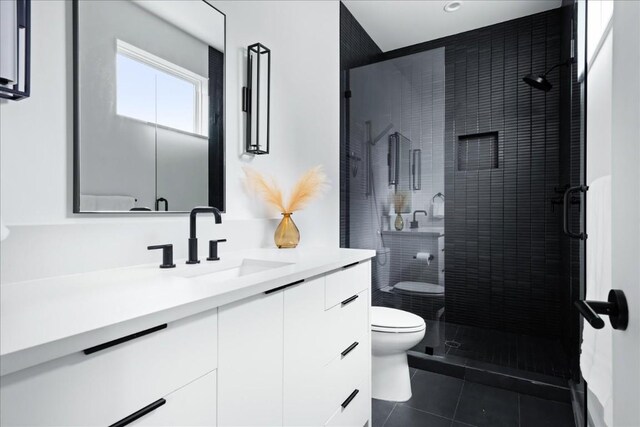 3204 Garden Villa Ln Unit 2, Austin, TX 78704 - full bath with toilet, vanity, tile patterned floors, and a shower stall