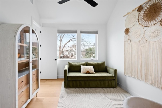 3204 Garden Villa Ln Unit 2, Austin, TX 78704 - sitting room with lofted ceiling, light wood-style floors, a ceiling fan, and baseboards